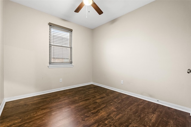 unfurnished room with dark wood-type flooring and ceiling fan