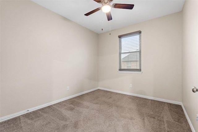 unfurnished room with ceiling fan and carpet