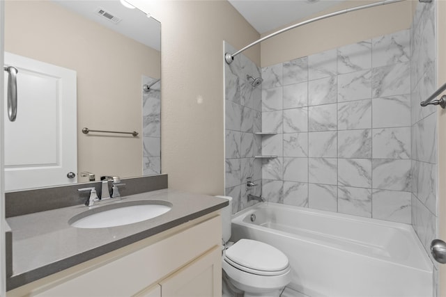 full bathroom with vanity, toilet, and tiled shower / bath combo