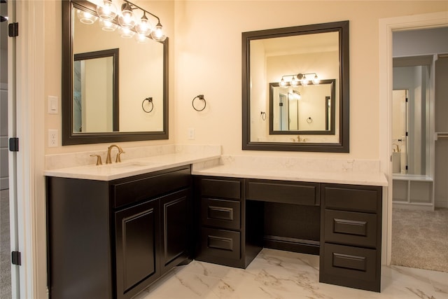 bathroom featuring marble finish floor and vanity