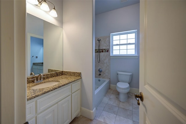 full bathroom with tiled shower / bath, vanity, toilet, and tile patterned floors