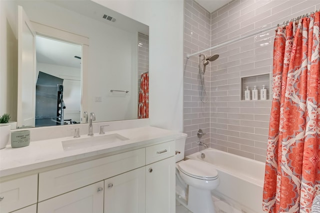 full bathroom featuring vanity, toilet, and shower / bath combo