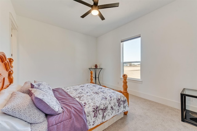 bedroom featuring ceiling fan and light carpet