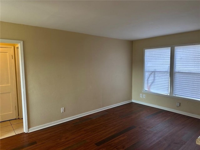 unfurnished room featuring wood-type flooring