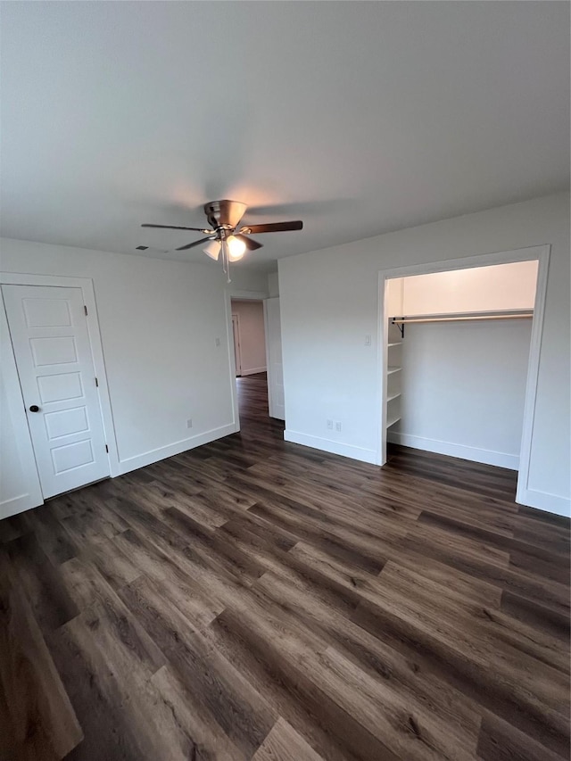 unfurnished bedroom with dark hardwood / wood-style floors and ceiling fan