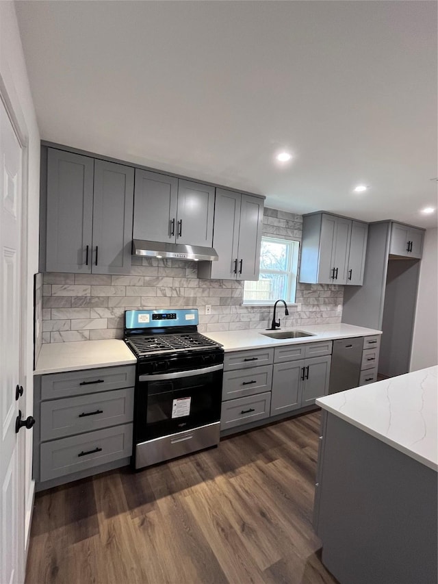 kitchen featuring gray cabinetry, sink, and appliances with stainless steel finishes