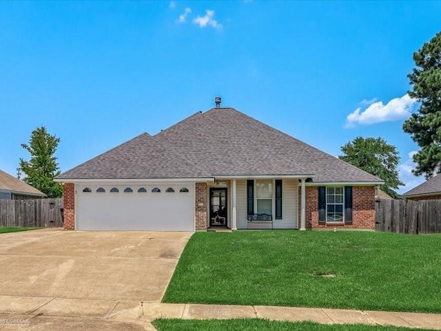 single story home with a garage and a front yard