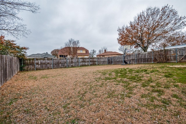 view of yard with a fenced backyard