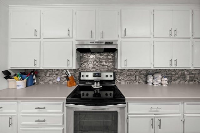 kitchen with white cabinetry, backsplash, and stainless steel electric range