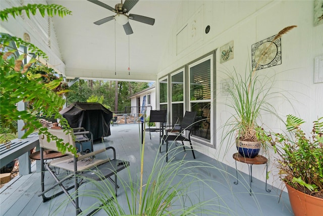 exterior space featuring area for grilling and ceiling fan