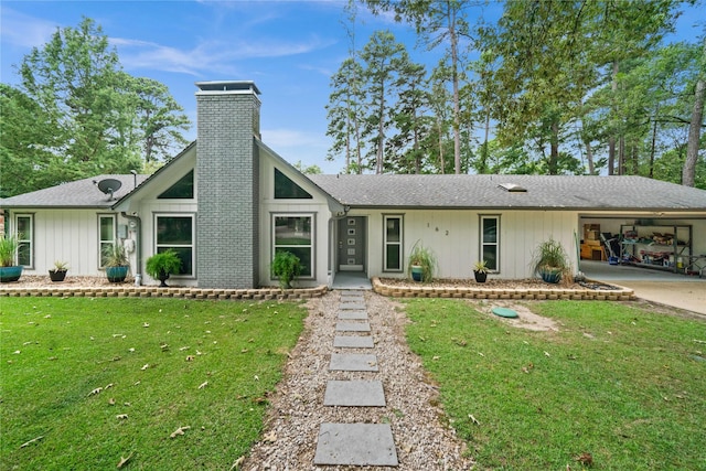 ranch-style house with a front lawn