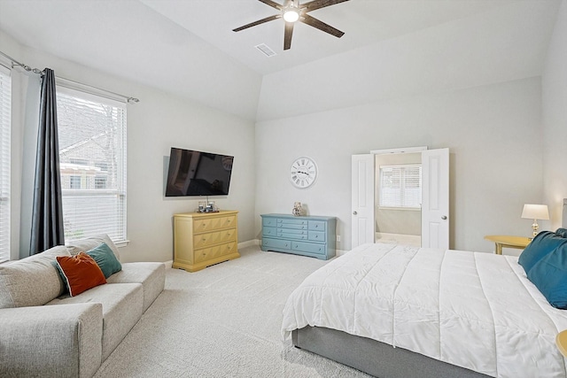 bedroom featuring light carpet, vaulted ceiling, and ceiling fan