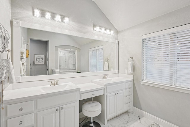 bathroom featuring vanity and vaulted ceiling