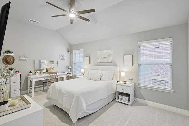 carpeted bedroom featuring vaulted ceiling and ceiling fan