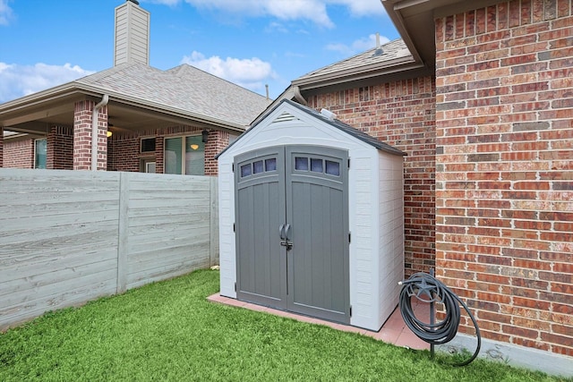 view of outdoor structure with a yard