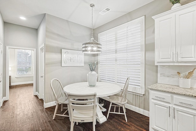 dining room featuring dark wood-type flooring