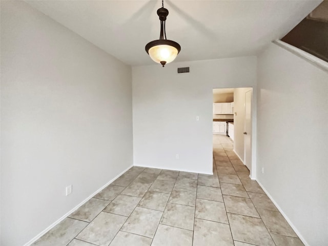 view of tiled spare room