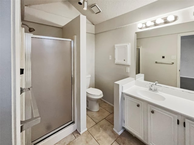 bathroom with tile patterned floors, toilet, a shower with shower door, a textured ceiling, and vanity