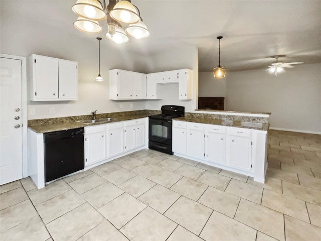 kitchen featuring sink, decorative light fixtures, black appliances, and white cabinets