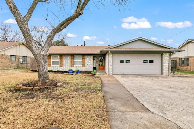 ranch-style home featuring a garage and a front lawn