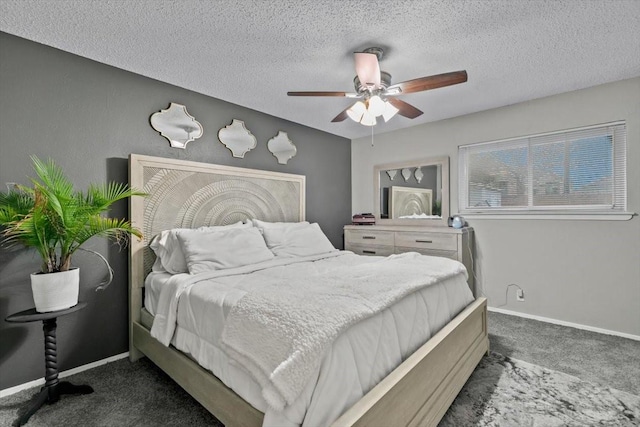 carpeted bedroom with ceiling fan and a textured ceiling