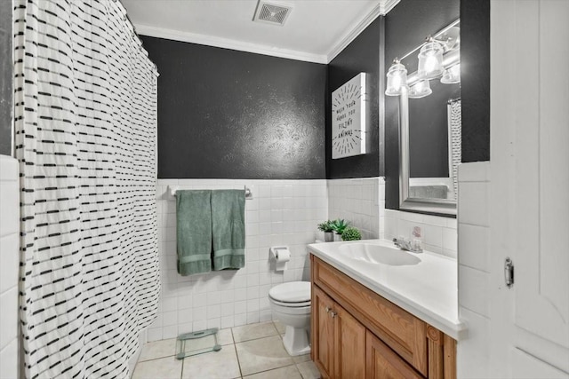 bathroom featuring toilet, tile walls, ornamental molding, vanity, and curtained shower