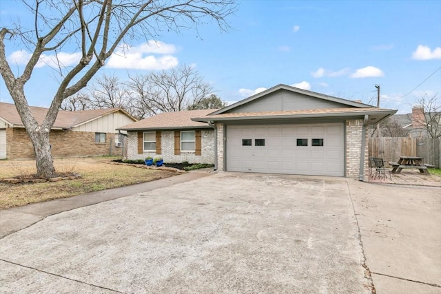 ranch-style home featuring a garage