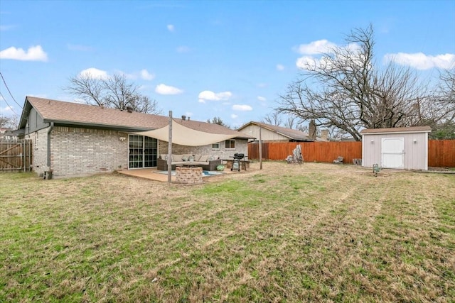 view of yard with a storage shed and a patio area