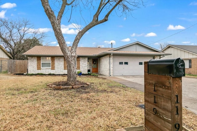 ranch-style home with a garage and a front yard