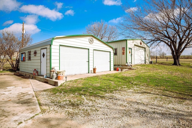 garage with a lawn