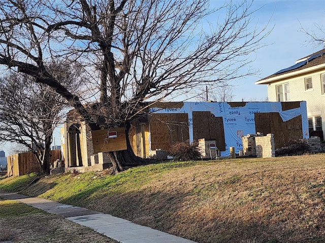 view of home's exterior with a yard