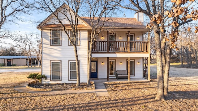 view of front facade with a porch and a balcony