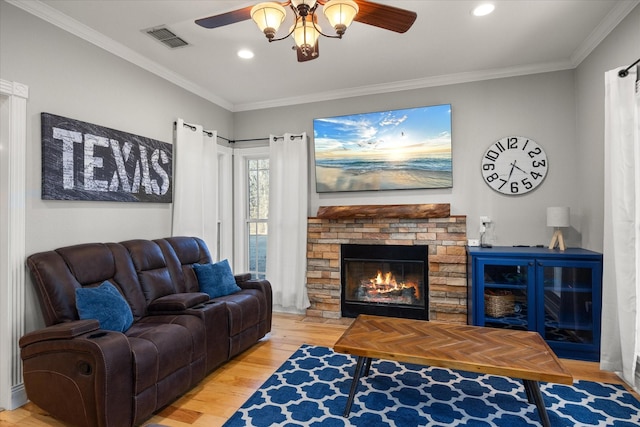 living room featuring crown molding, ceiling fan, and hardwood / wood-style floors