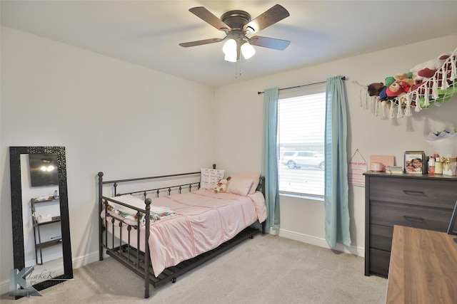 bedroom with light colored carpet and ceiling fan