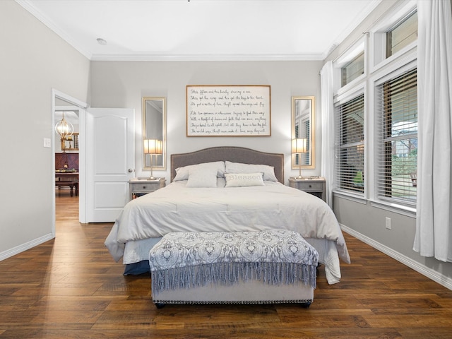 bedroom with ornamental molding and dark hardwood / wood-style floors