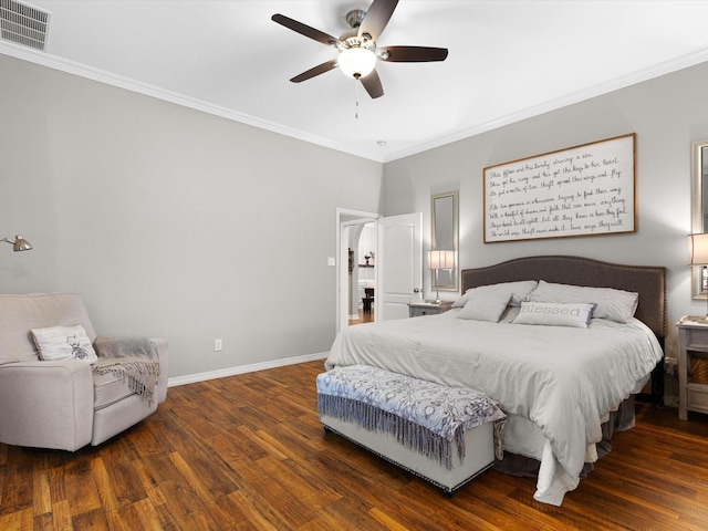 bedroom with ornamental molding and dark hardwood / wood-style floors