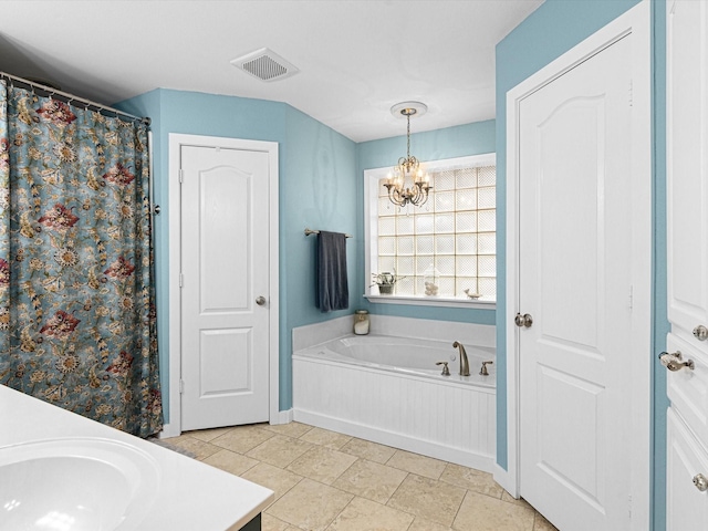 bathroom with vanity, a notable chandelier, and shower with separate bathtub