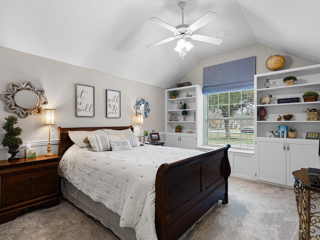 carpeted bedroom with vaulted ceiling and ceiling fan