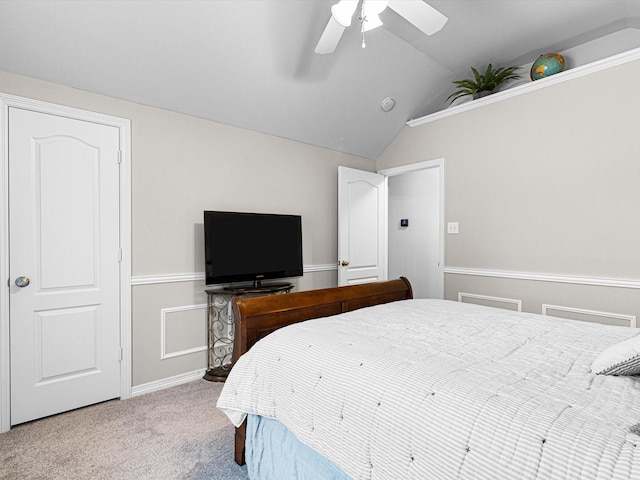 carpeted bedroom with vaulted ceiling and ceiling fan