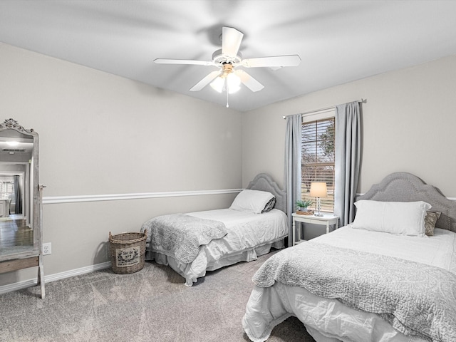 bedroom with ceiling fan and carpet flooring