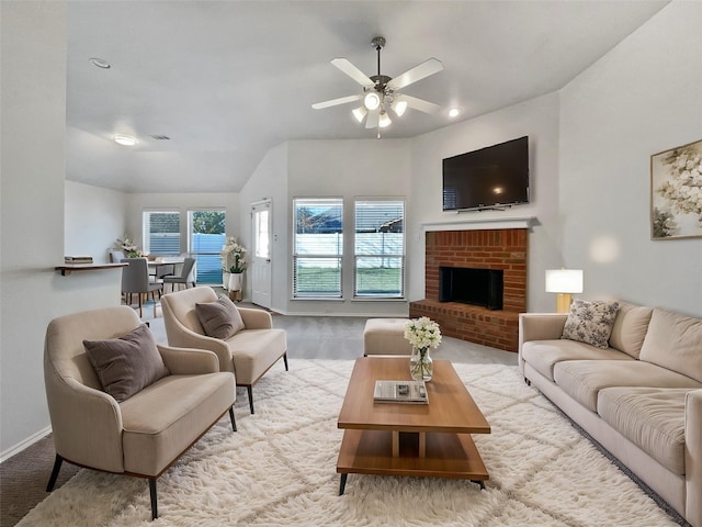 living room with a brick fireplace and ceiling fan