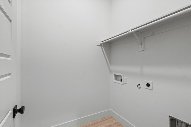 laundry room featuring wood-type flooring, hookup for an electric dryer, hookup for a gas dryer, and hookup for a washing machine