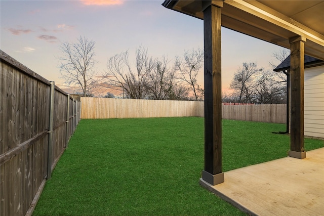 yard at dusk with a patio