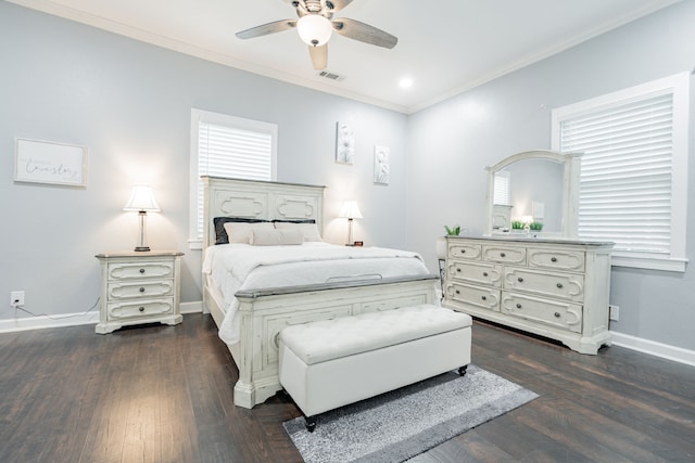 bedroom featuring dark wood-type flooring, ceiling fan, and ornamental molding