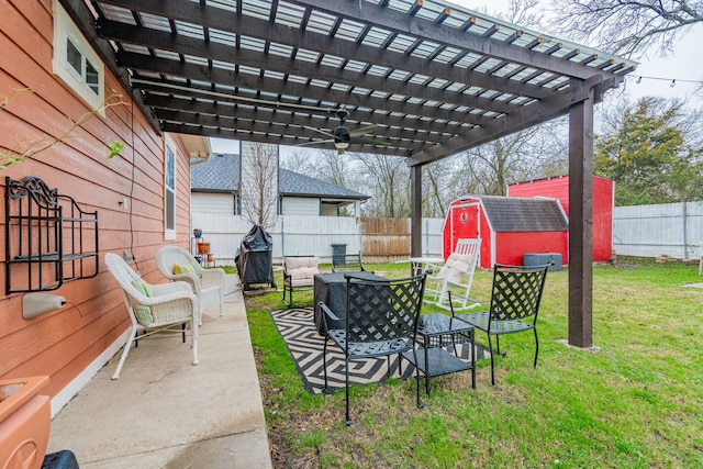 view of patio featuring a storage shed and a pergola