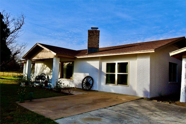 rear view of house featuring a patio area