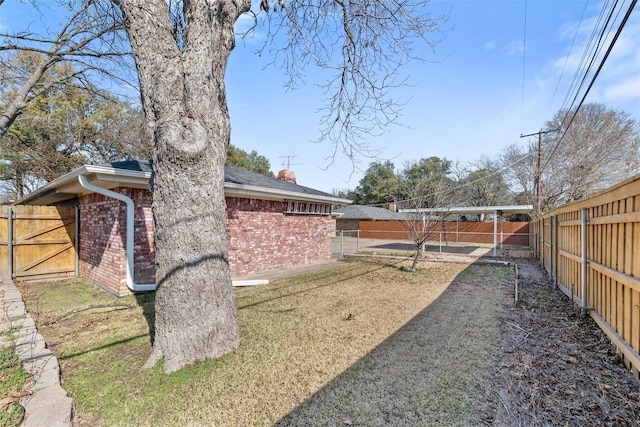 view of yard with a fenced backyard