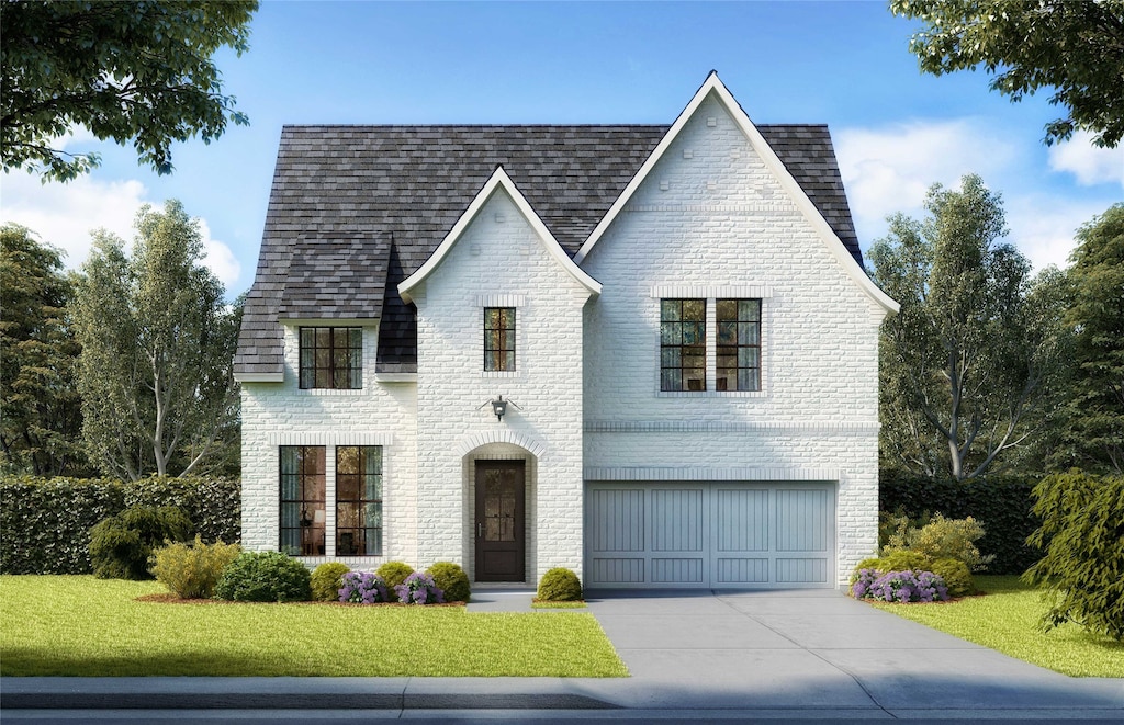 view of front facade with a garage and a front yard