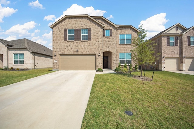 view of front of home with a garage and a front yard