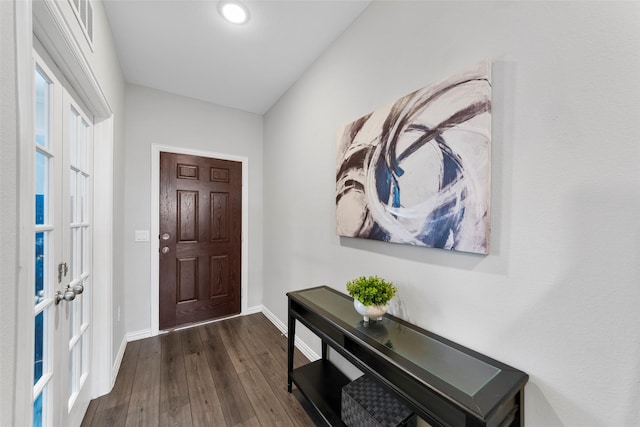 entryway with dark wood-type flooring